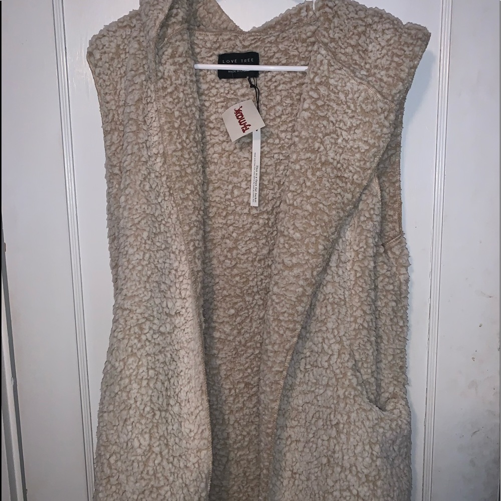Faux fur sleeveless vest with hood